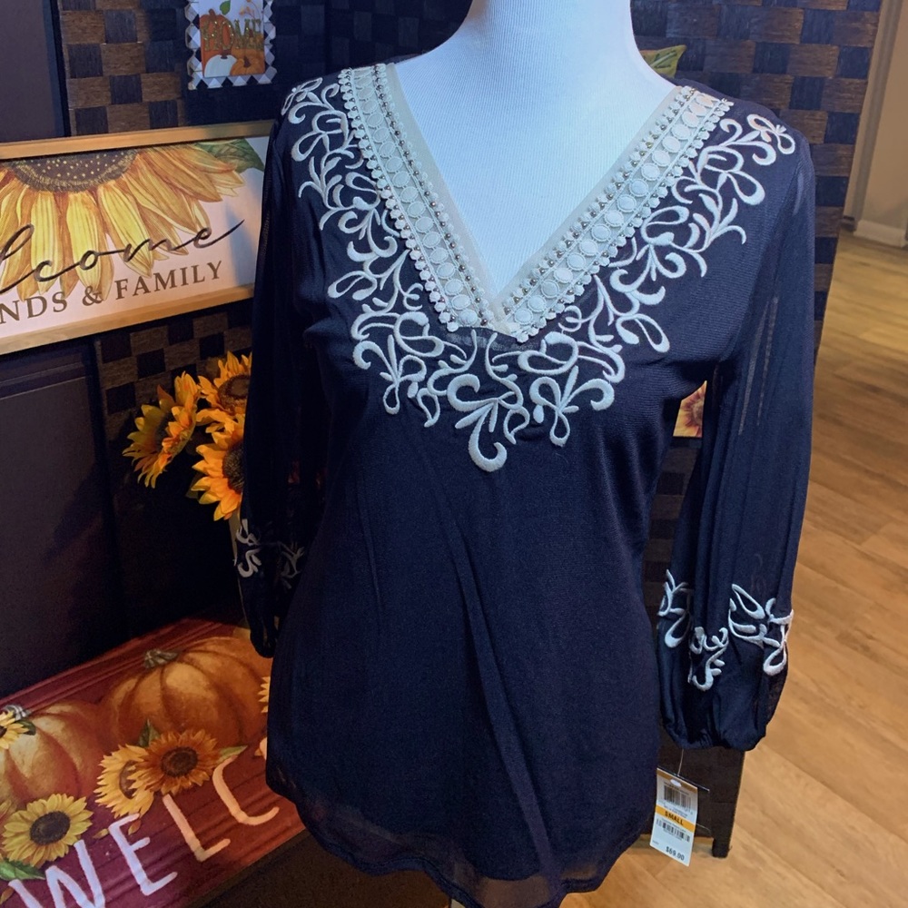 Woman’s size small dress blouse black.